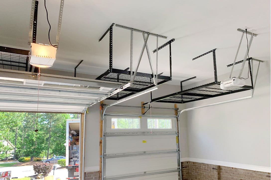 Two medal overhead storage units in garage