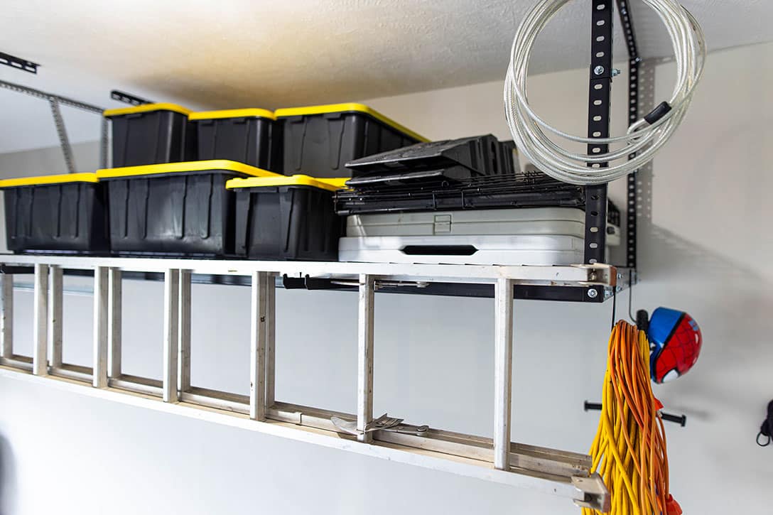 Overhead storage on garage wall with totes