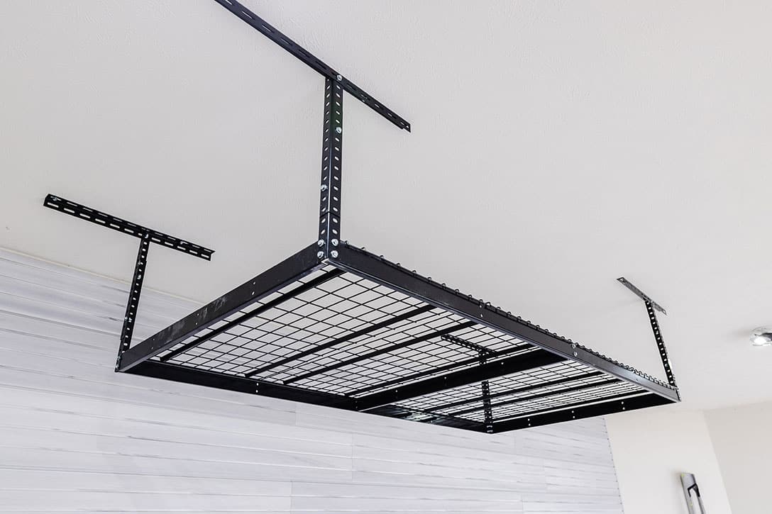 Medal overhead storage in ceiling of garage
