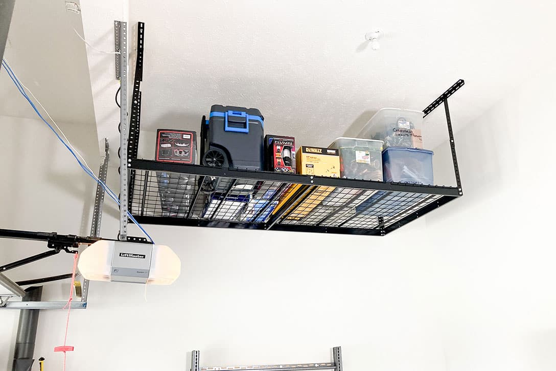 An overhead storage unit with totes and boxes