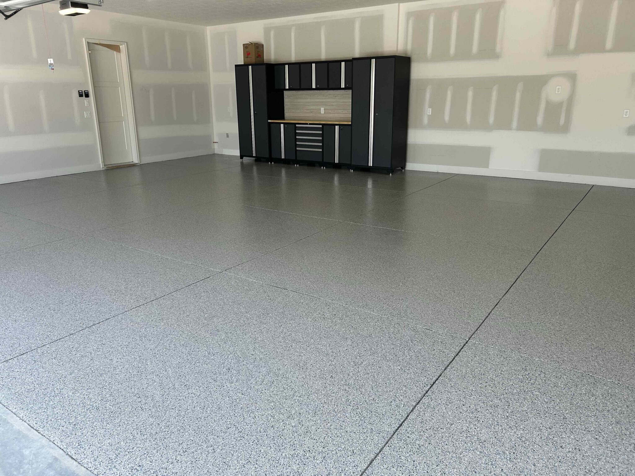 1_Omaha_FloorCabinet_0831_BlueTaupe_Waterloo_A blue taupe garage floor coating