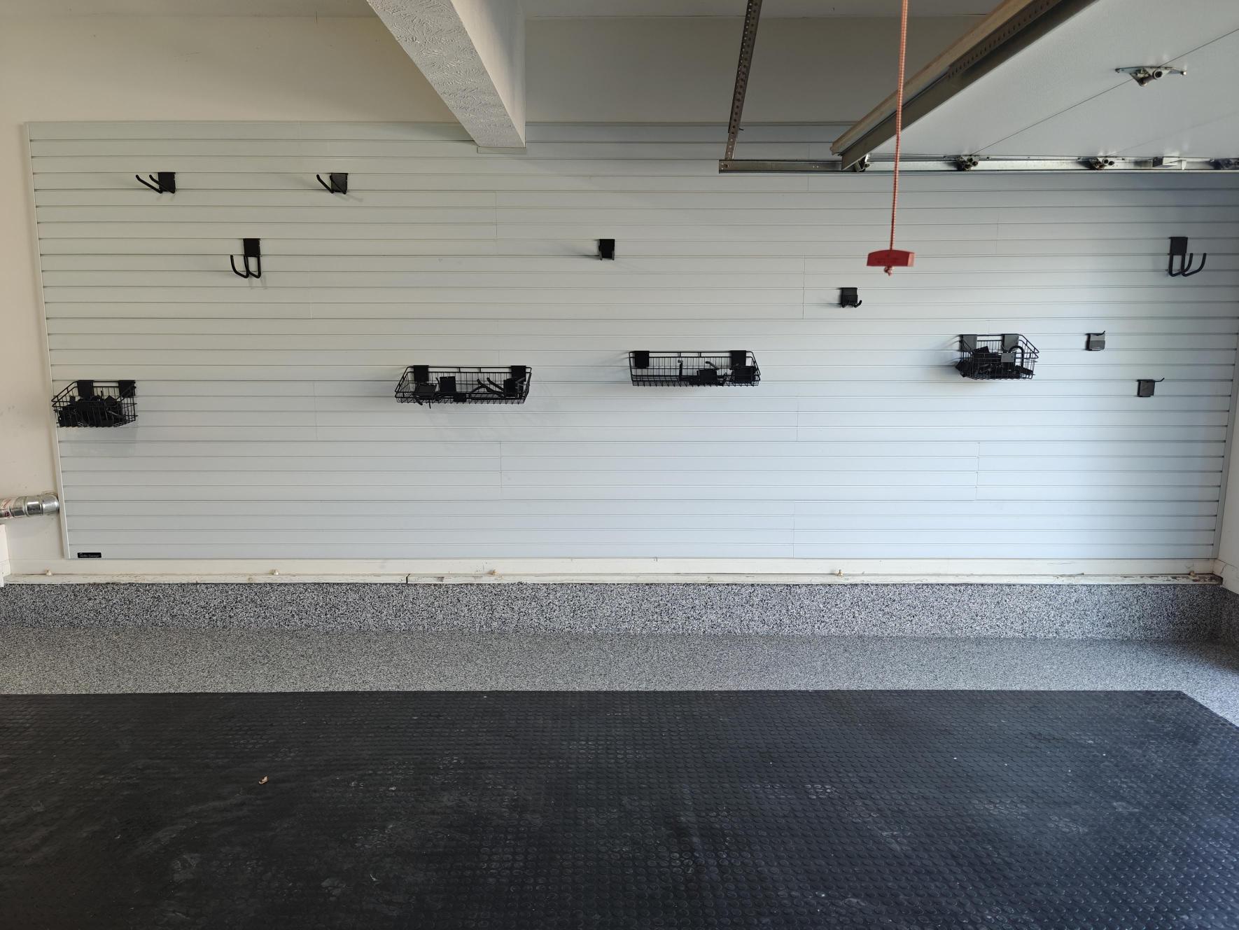 Wall with added slatwall panels for storage