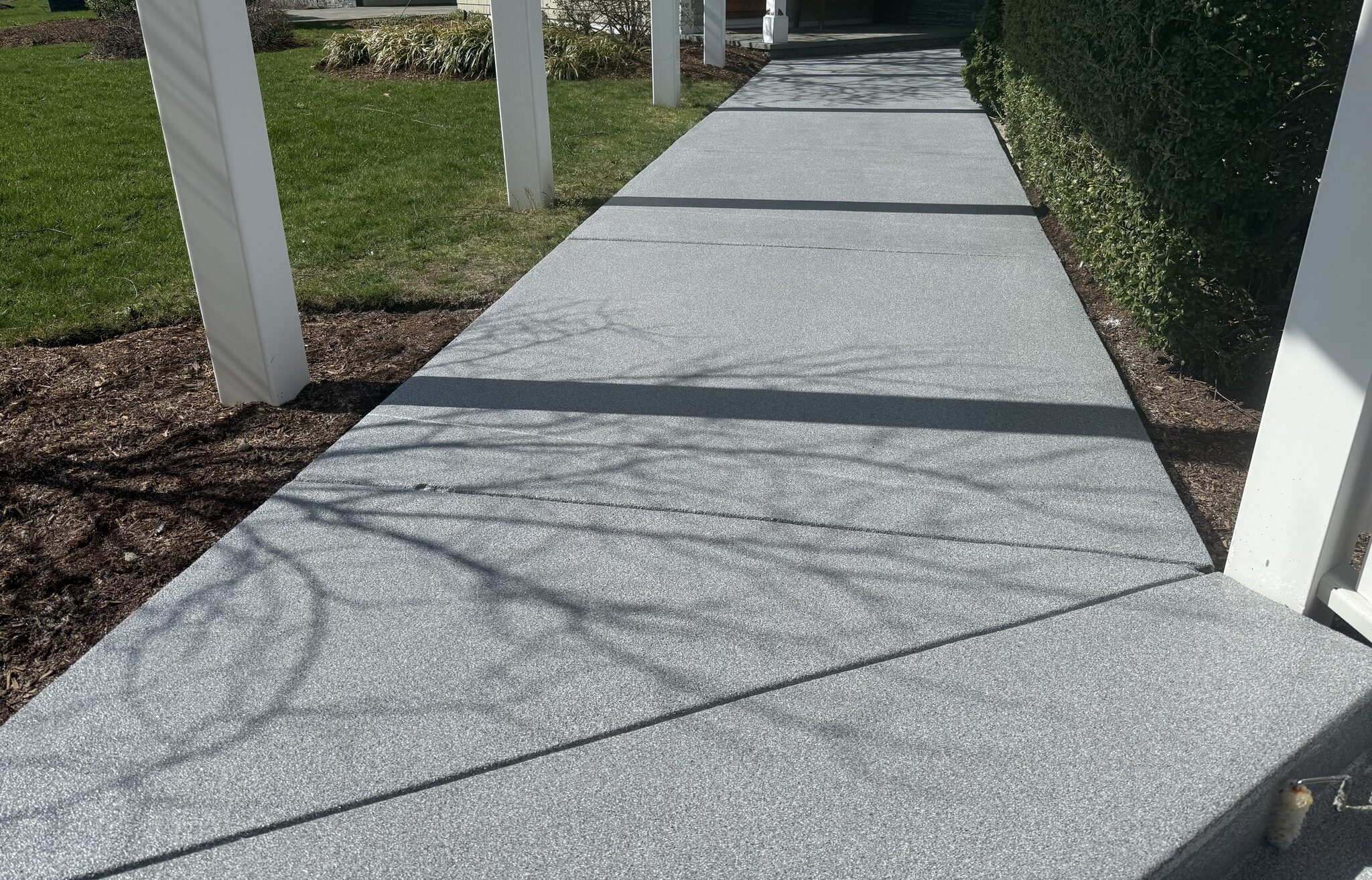 Polyaspartic coated front walkway