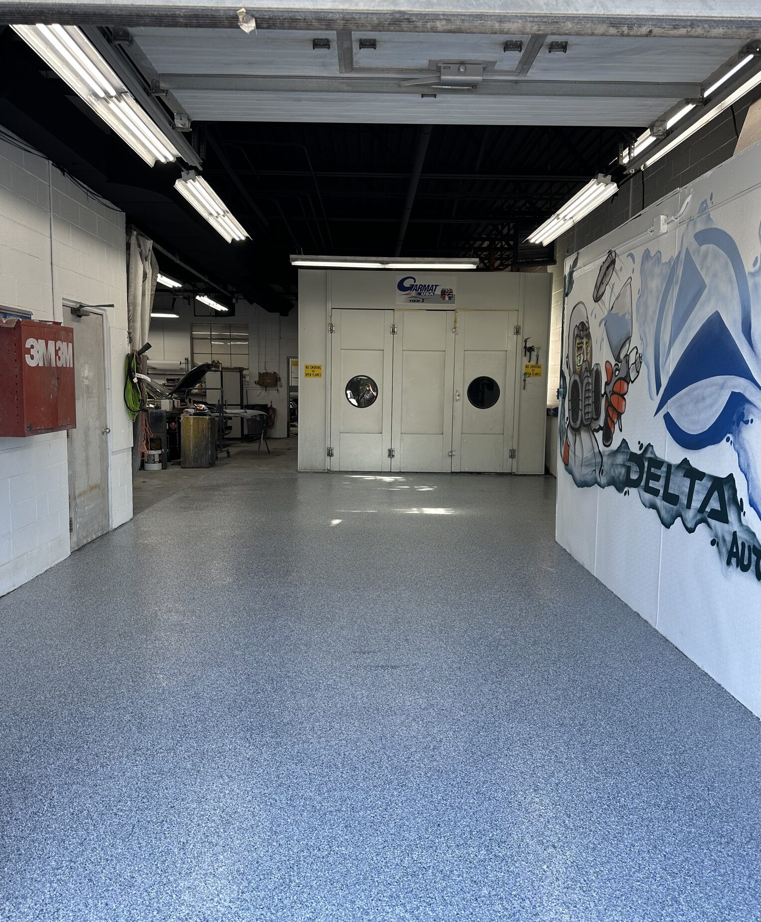 Polyaspartic coated concrete in auto shop