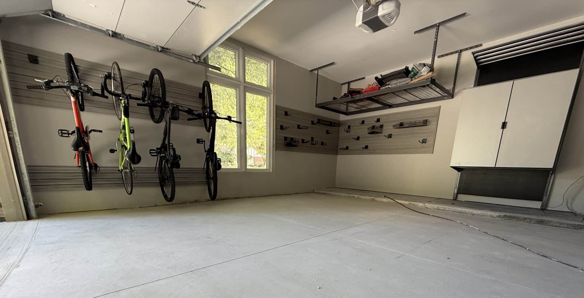Organized garage with slatwall and cabinets