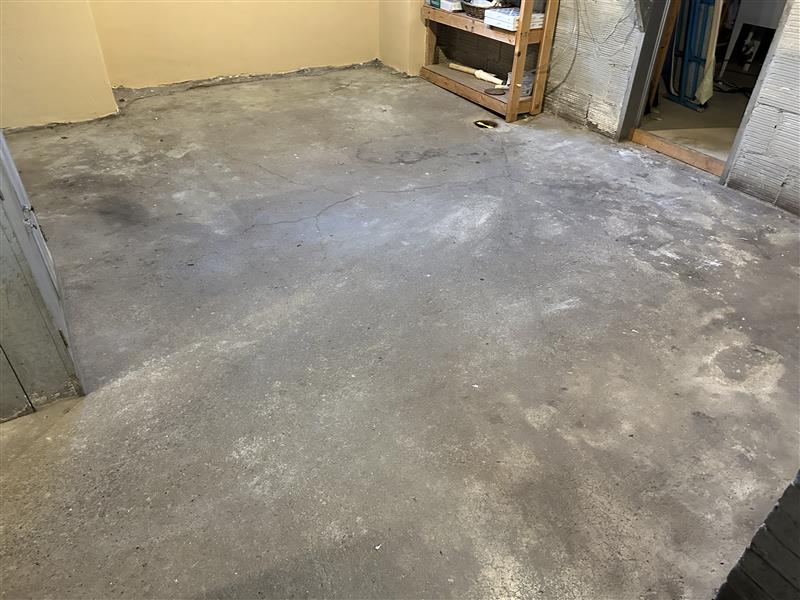 stained and cracked basement concrete