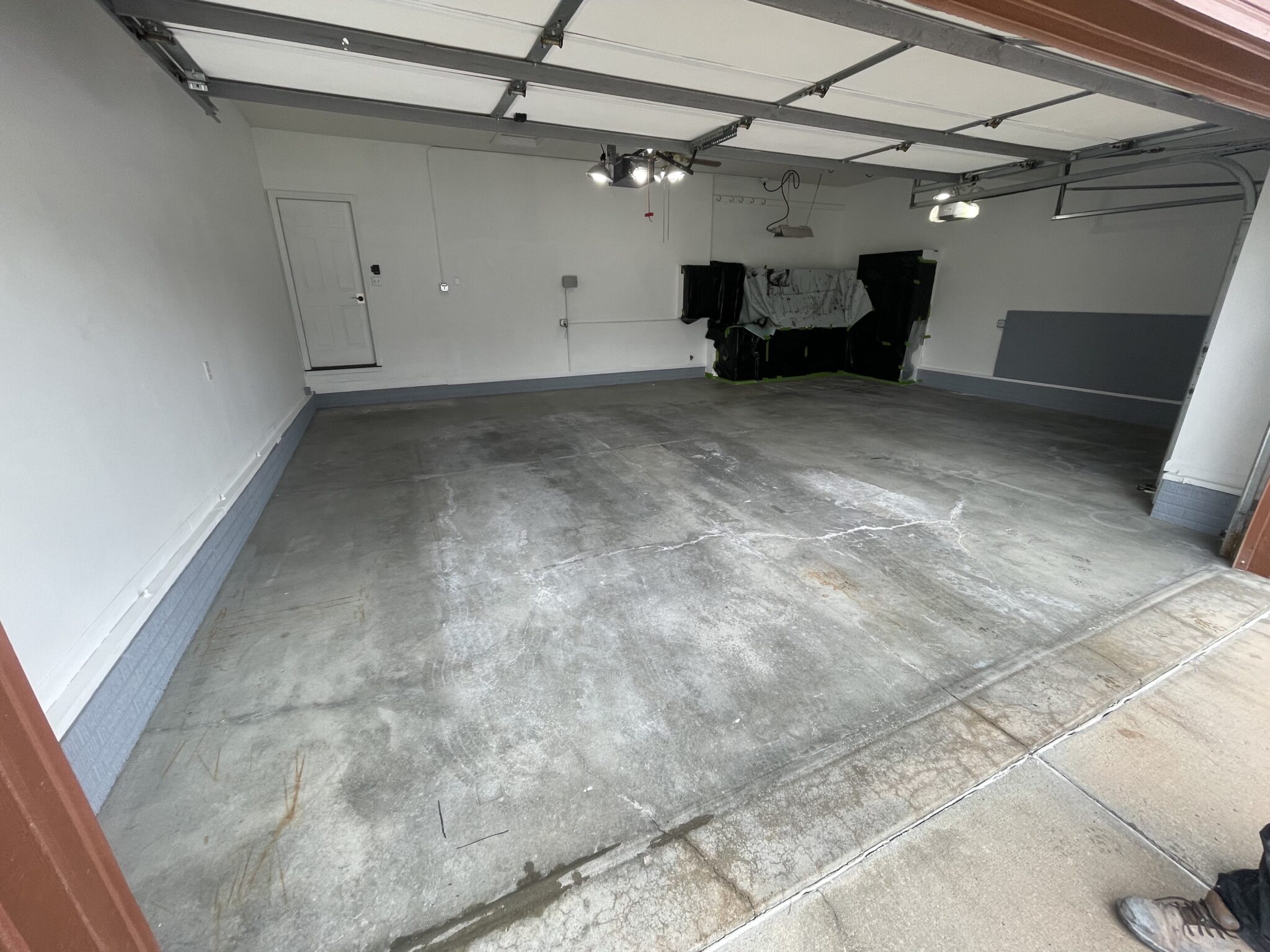 dingy stained garage concrete