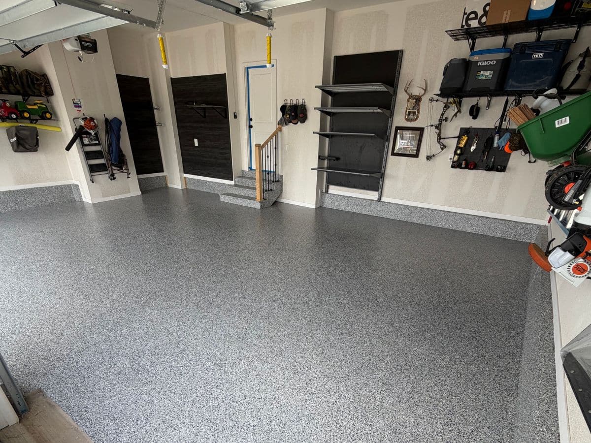 garage with new flooring and shelving