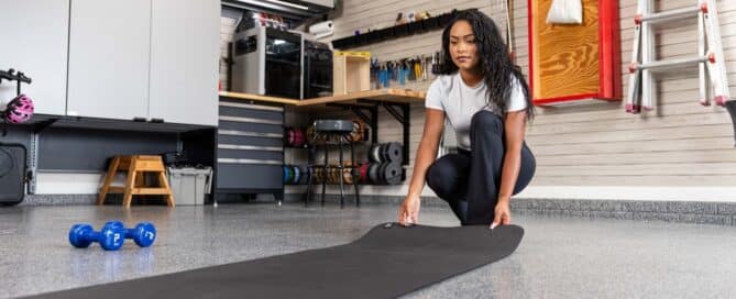 woman with yoga mat in garage