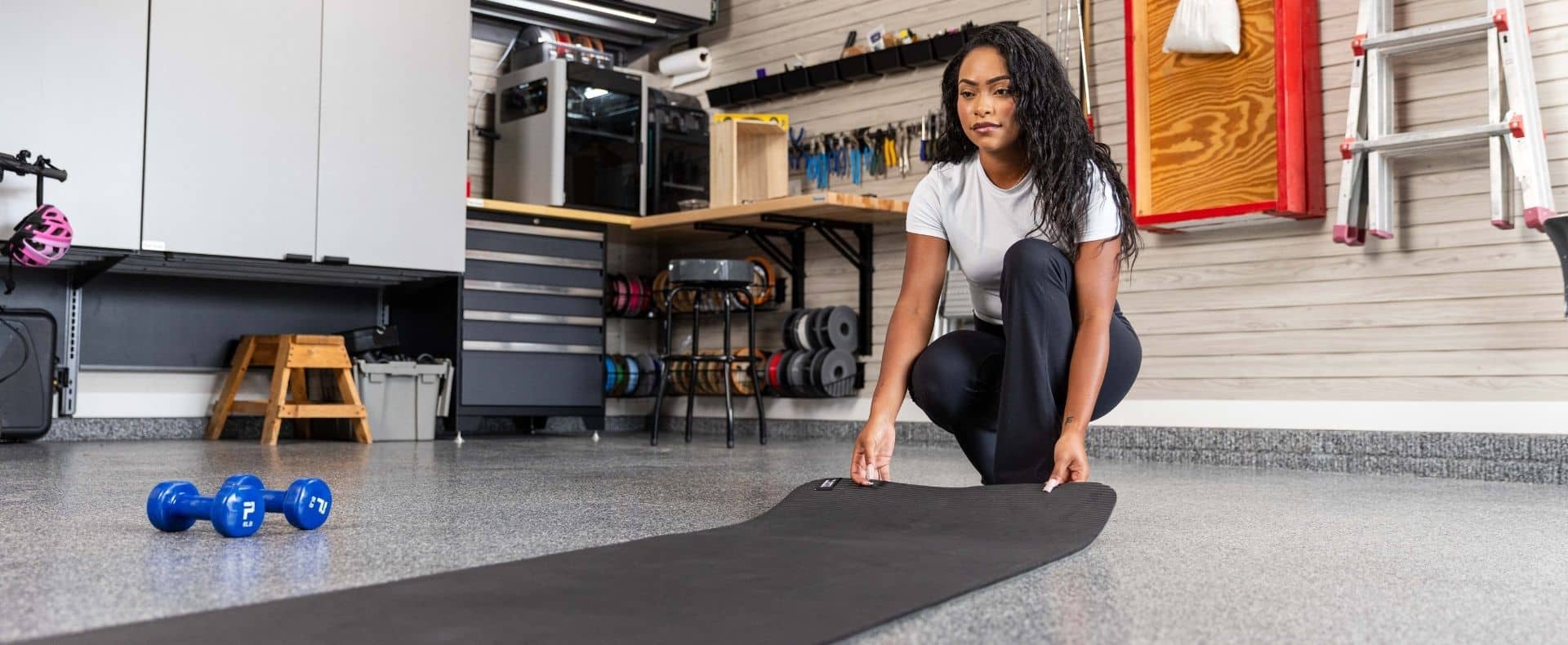 woman with yoga mat in garage